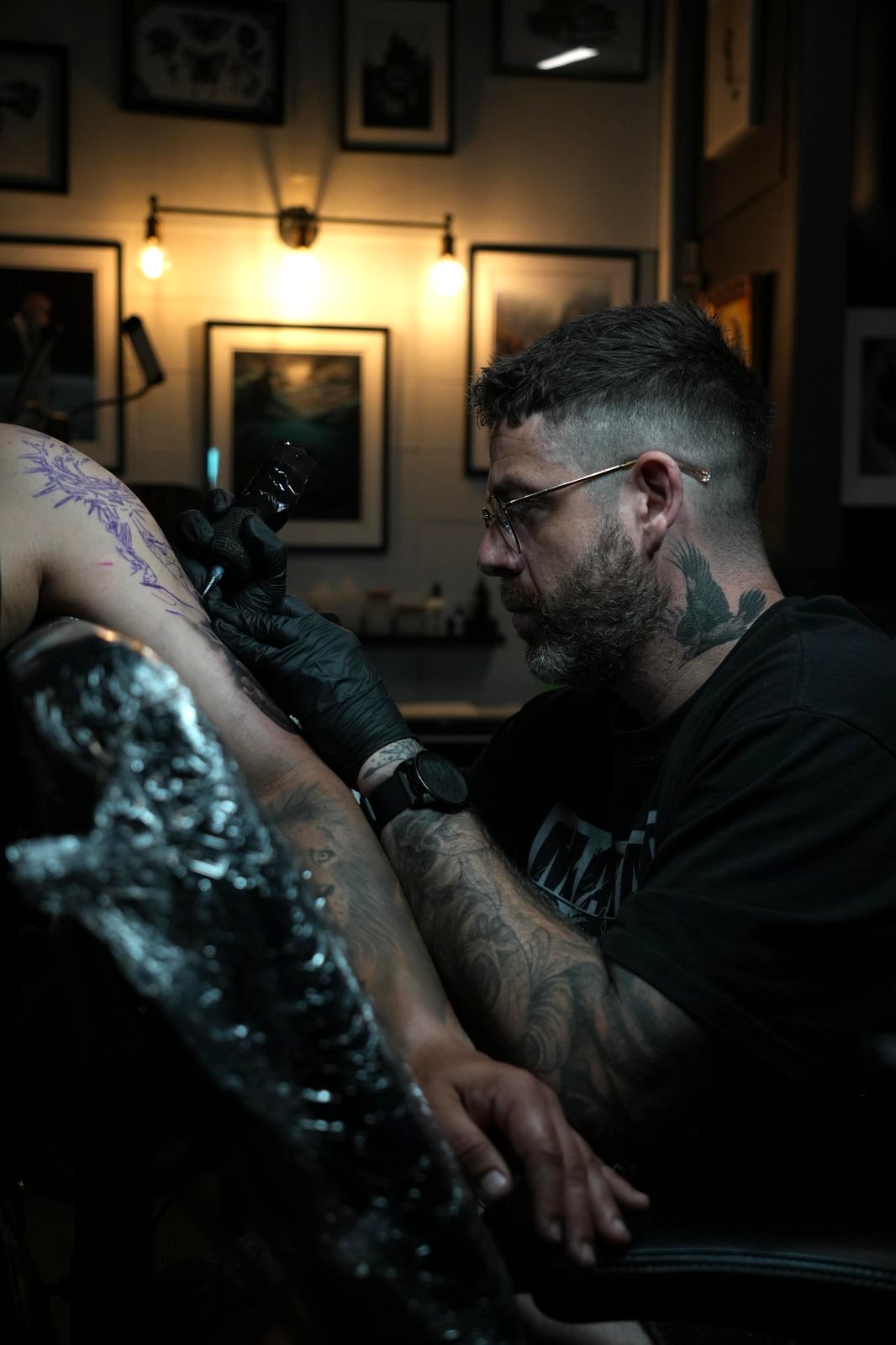 Bacca tattoo artist working in studio